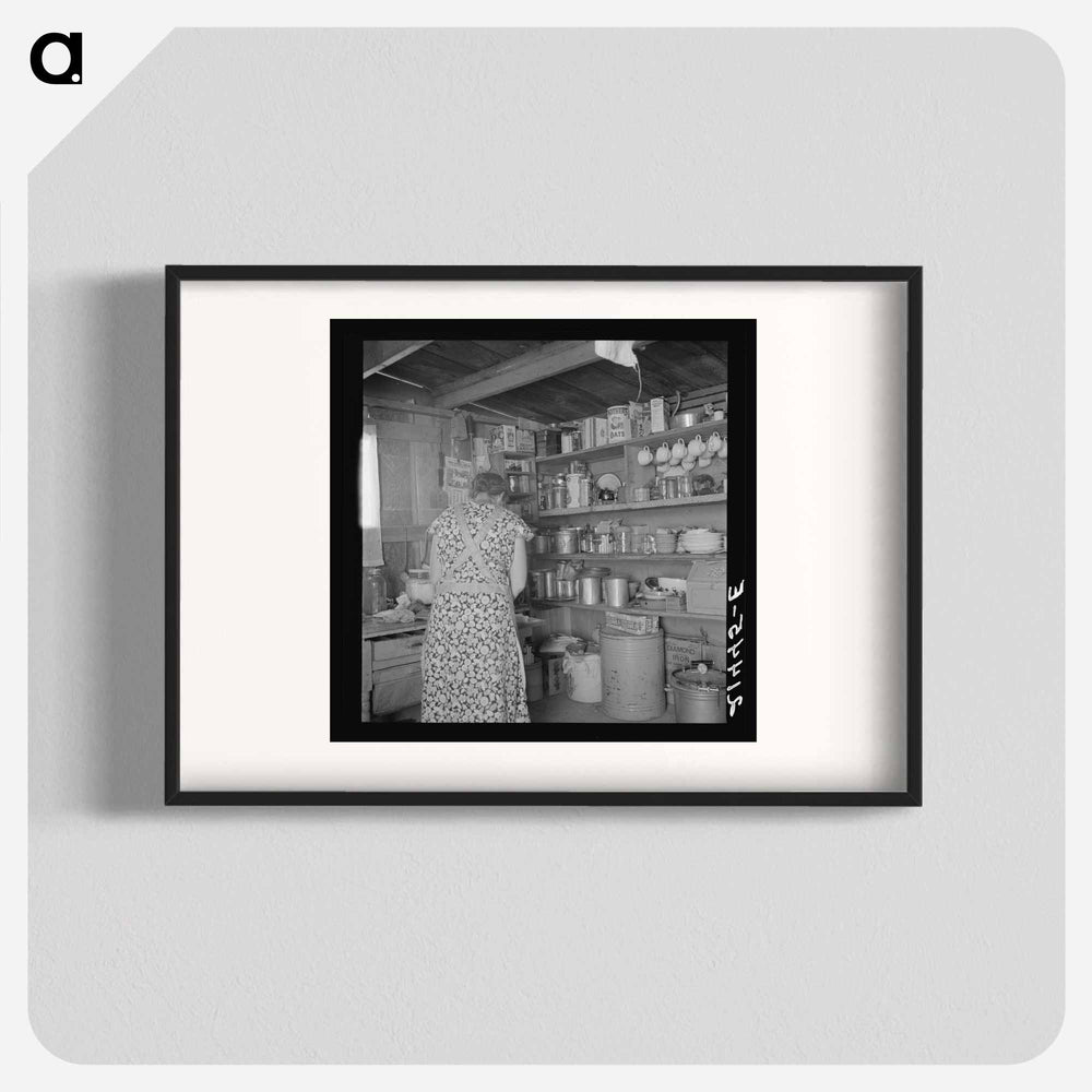 Woman getting lunch in kitchen of home - Dorothea Lange Poster.