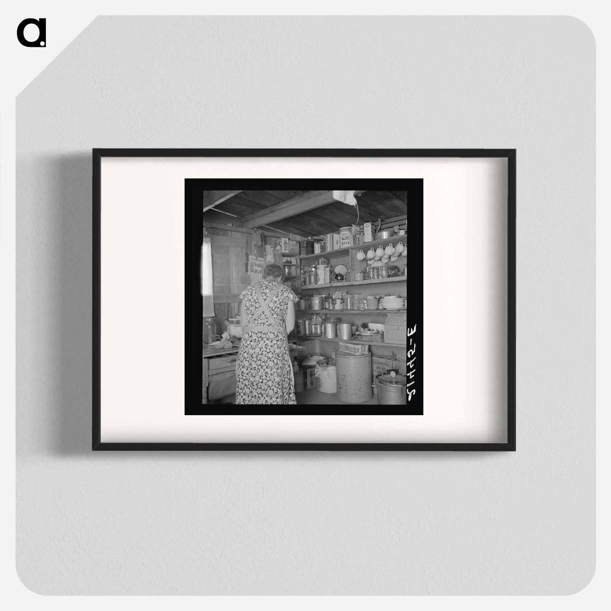 Woman getting lunch in kitchen of home - Dorothea Lange Poster.