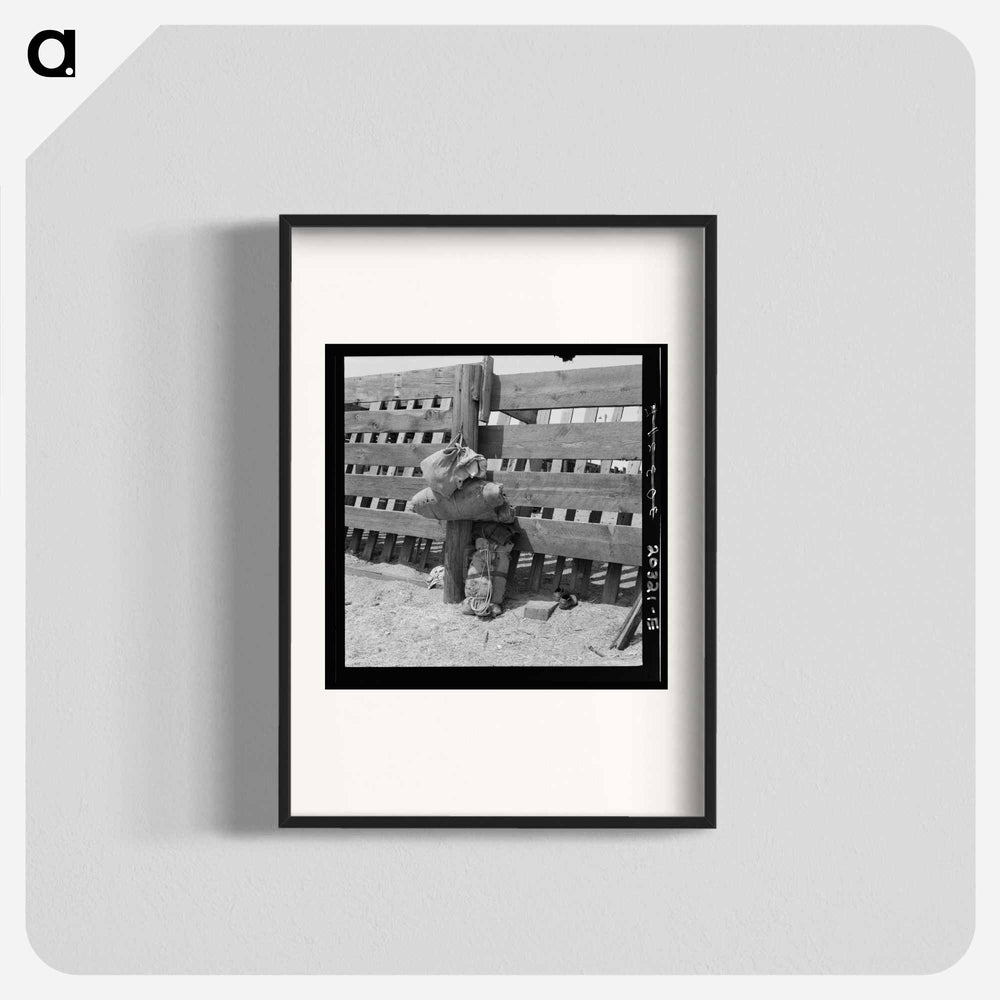 Bundles against cattle corrals by the railroad track - Dorothea Lange Poster.
