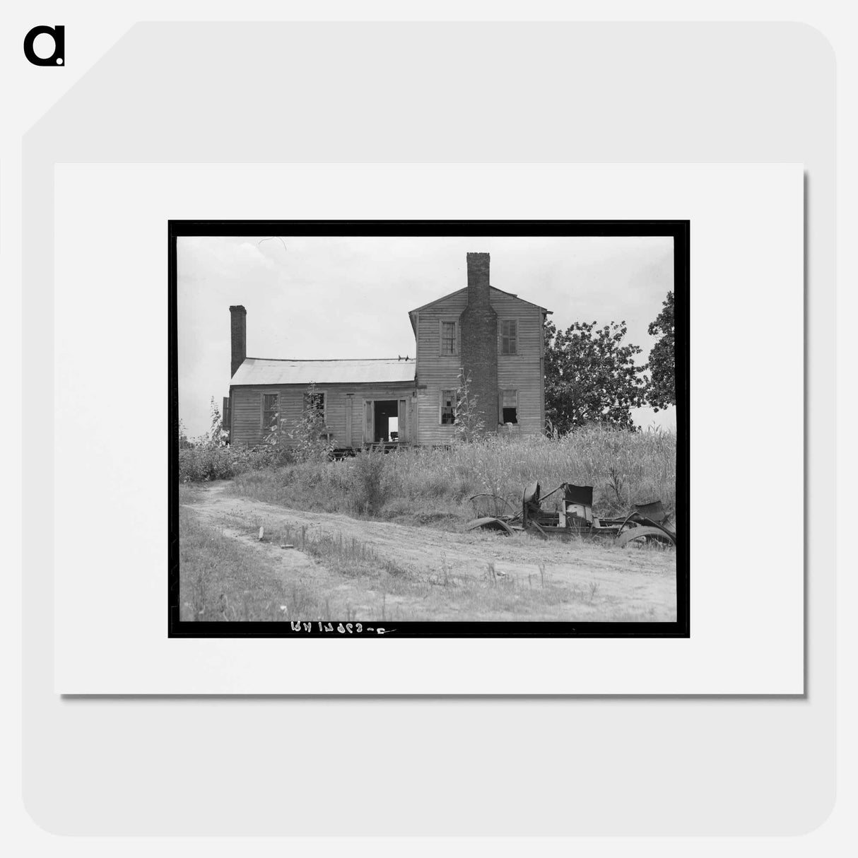 A plantation house decaying and now vacant but for two rooms occupied by an old couple, tenants. - Dorothea Lange Poster.