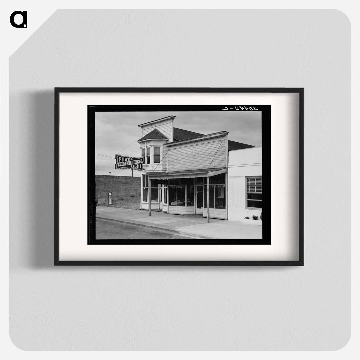 Western Washington, Grays Harbor country. Elma. Main street. Note modern building which adjoins Elma city hall. The real estate and flower business is across the street. Sourced from the Library of Co - Dorothea Lange Poster.