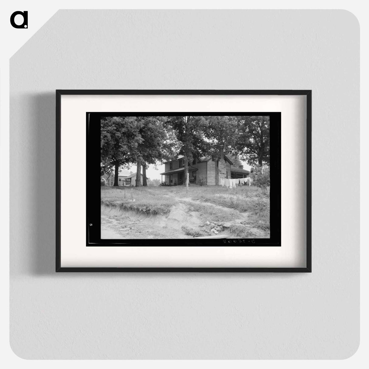 The one-and-a-half story part of this house was built fifty to sixty years ago. The two-story part was built in 1900. Farm is owned by a woman whose husband died seventeen years ago. Person County, No - Dorothea Lange Poster.