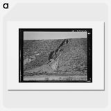 Water seepage from newly irrigated land on top of bench, eroding sides. A problem for the Reclamation Service, Dead Ox Flat, Malheur County, Oregon. - Dorothea Lange Poster.